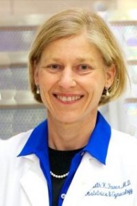 Dr. Favor (headshot) in white labcoat